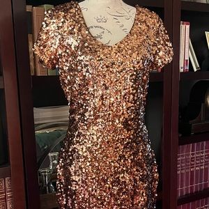 Gold sequin fitted dress.